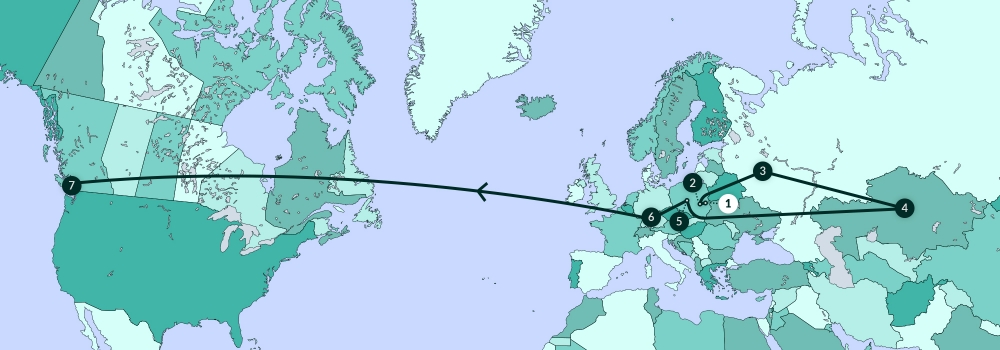 Une carte grise illustrant la plupart de l'Amérique du Nord, de l’Europe, et une partie de l’Afrique. Une ligne traverse divers endroits de la carte.