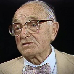 Screenshot of Holocaust survivor Joseph Klinghoffer video testimony. He is sitting in front of a black background, and looking to the left of the camera. The camera shows his face and shoulders.